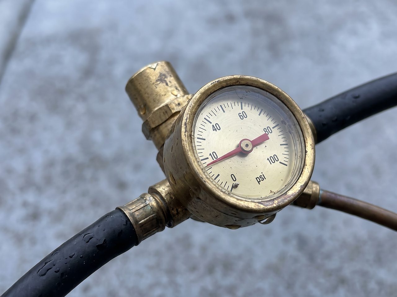 inline air regulator gauge showing a deliberately low pressure setting